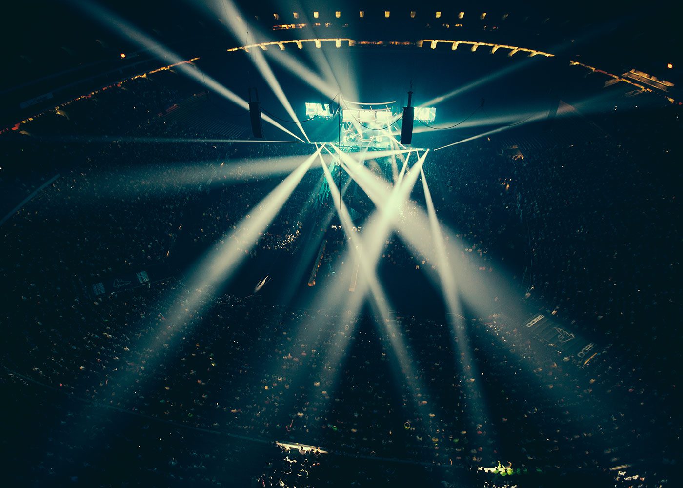 stage lit up by stadium lights at concert