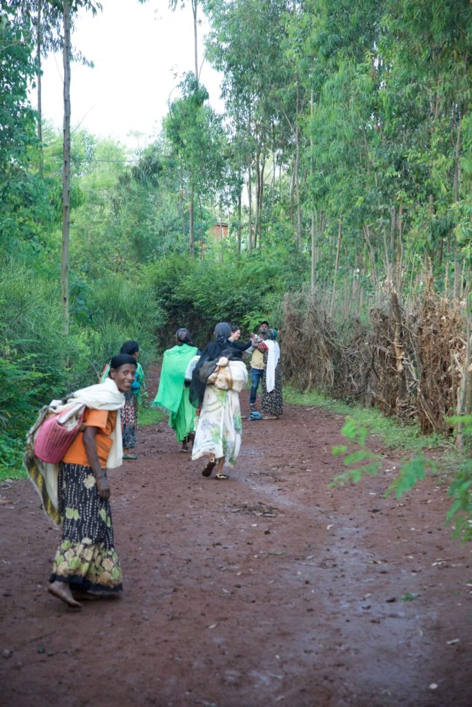 Women stop to greet us in the village. 