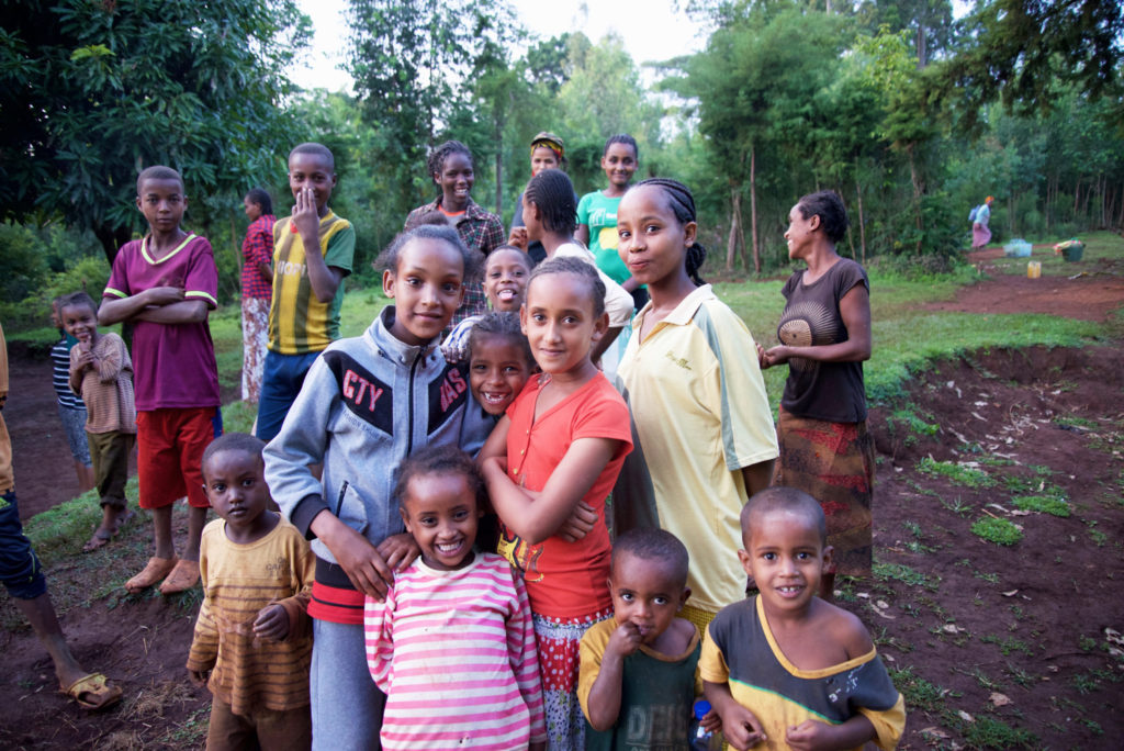 Children in Shinshicho stop by to say hello as we visit families in the village. 