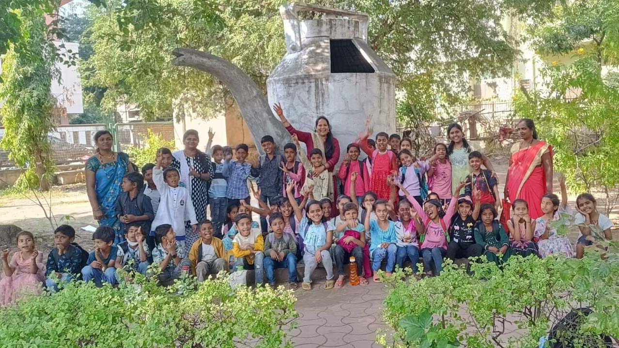 Group of children and caregivers in India gather for a picture