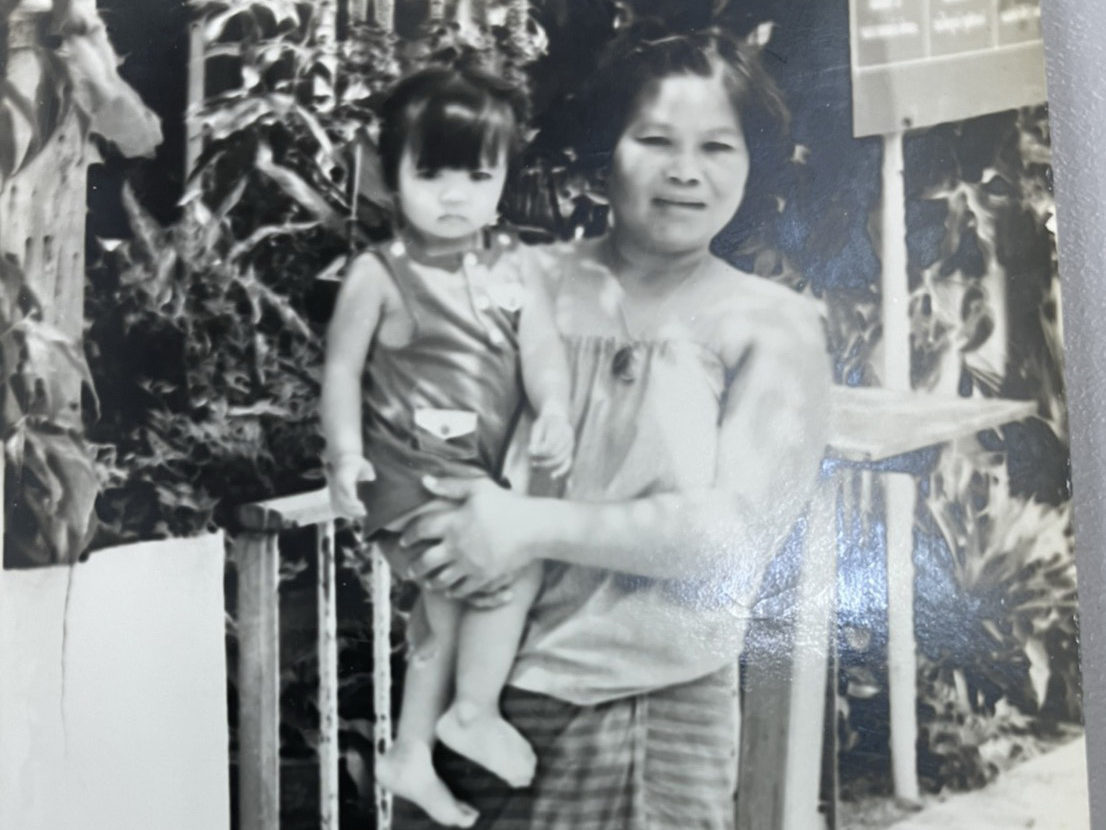 scanned black and white photo of woman holding small girl